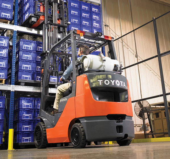  Toyota propane forklift operator storing a load in a warehouse